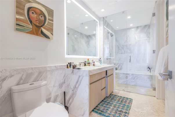 Bathroom, Dual Sink Vanities, Glass Shower, Interior, Marble Walls, Recessed Lighting