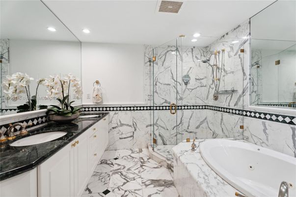 Bathroom, Dual Sink Vanities, Glass Shower, Interior, Marble, Marble Walls, Recessed Lighting