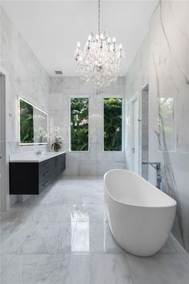 Bathroom, Chandelier, Dual Sink Vanities, Free Standing Baths, Interior, Marble, Marble Walls