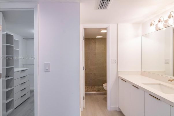 Bathroom, Dual Sink Vanities, Glass Shower, Interior, Walk-in Closets, Wood Texture Flooring