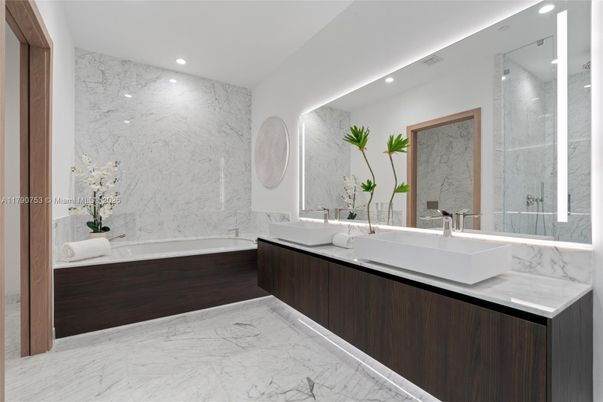 Bathroom, Dual Sink Vanities, Glass Shower, Interior, Marble, Marble Walls, Recessed Lighting
