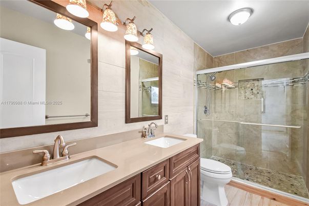 Bathroom, Dual Sink Vanities, Glass Shower, Interior, Wood Texture Flooring