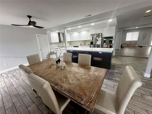Dining room, Interior, Kitchen, Recessed Lighting, Stainless Steel Appliances, Wood Texture Flooring