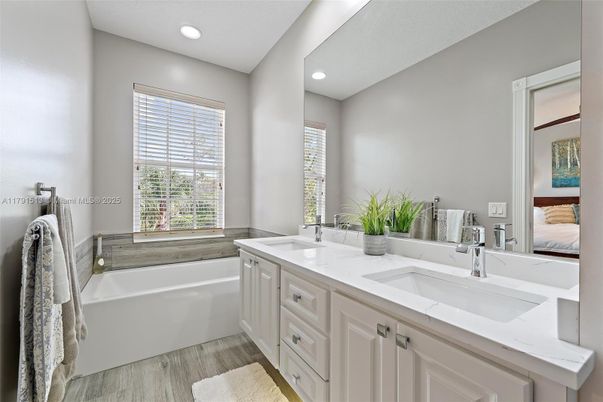 Bathroom, Dual Sink Vanities, Interior, Recessed Lighting, Wood Texture Flooring