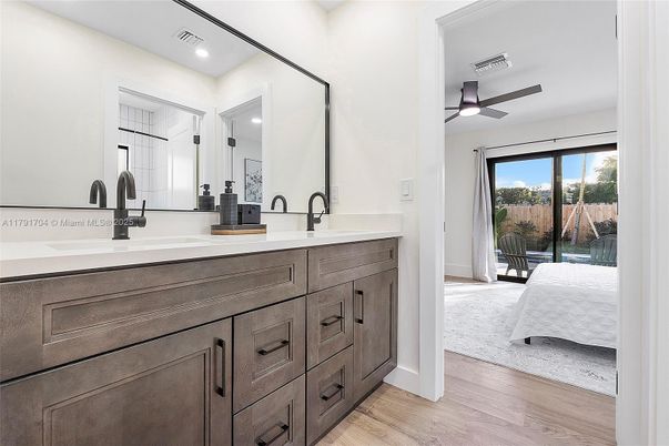 Bathroom, Dual Sink Vanities, Interior, Recessed Lighting, Wood Texture Flooring