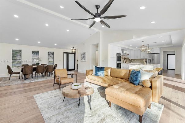 Chandelier, Dining room, Interior, Kitchen, Living room, Pendant Lights, Recessed Lighting, Stainless Steel Appliances, Wood Texture Flooring