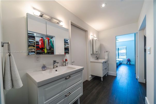 Bathroom, Dual Sink Vanities, Interior, Recessed Lighting, Wood Texture Flooring