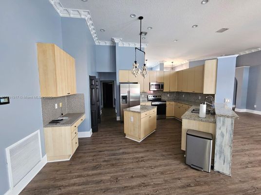 Chandelier, Interior, Kitchen, Pendant Lights, Recessed Lighting, Stainless Steel Appliances, Wood Texture Flooring