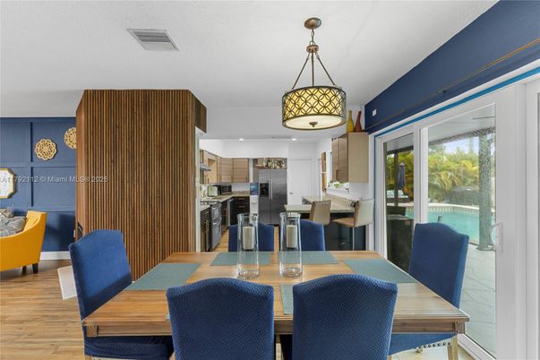 Dining room, Interior, Kitchen, Pendant Lights, Recessed Lighting, Stainless Steel Appliances, Wood Texture Flooring