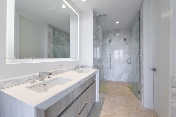 Bathroom, Dual Sink Vanities, Glass Shower, Interior, Marble Walls, Recessed Lighting