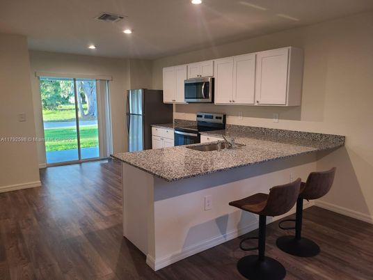 Interior, Kitchen, Recessed Lighting, Stainless Steel Appliances, Wood Texture Flooring