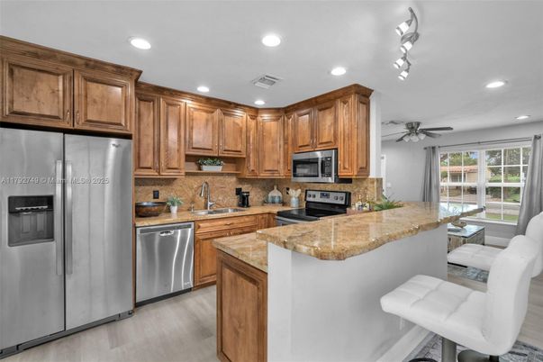 Interior, Kitchen, Recessed Lighting, Stainless Steel Appliances, Wood Texture Flooring
