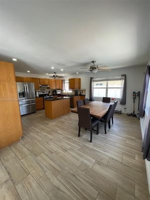 Dining room, Interior, Kitchen, Recessed Lighting, Stainless Steel Appliances, Wood Texture Flooring