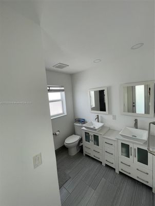 Bathroom, Dual Sink Vanities, Interior, Recessed Lighting, Wood Texture Flooring
