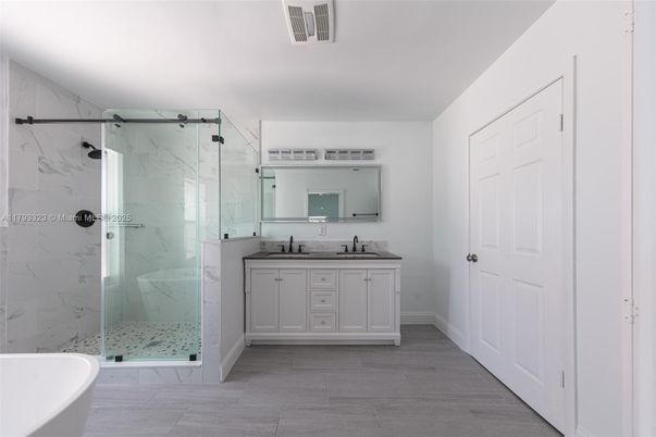 Bathroom, Dual Sink Vanities, Free Standing Baths, Glass Shower, Interior, Marble Walls, Wood Texture Flooring