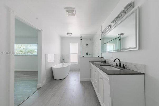 Bathroom, Dual Sink Vanities, Free Standing Baths, Interior, Wood Texture Flooring