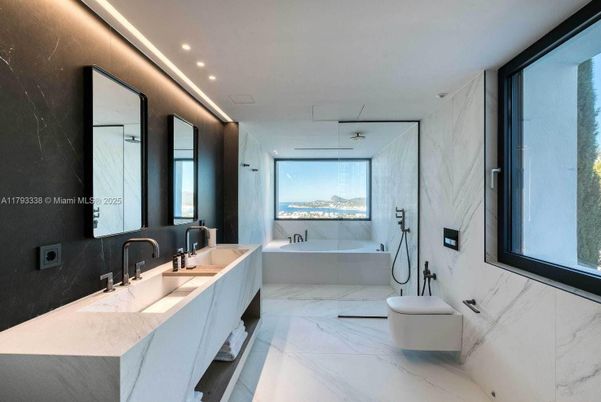 Bathroom, Dual Sink Vanities, Glass Shower, Interior, Marble, Marble Walls, Recessed Lighting