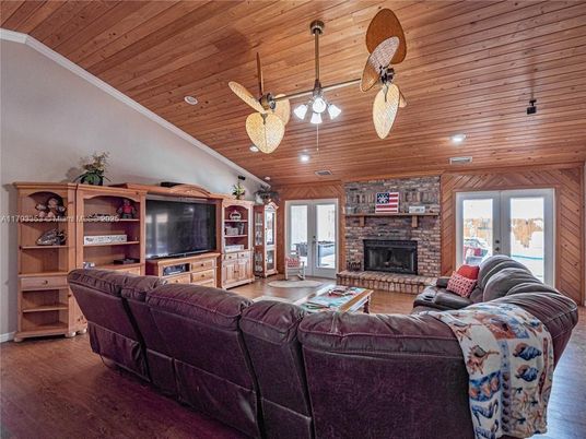 Fireplace, Interior, Living room, Pendant Lights, Recessed Lighting, Stone Walls, Wooden Ceilings, Wood Texture Flooring