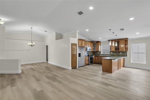 Chandelier, Interior, Kitchen, Pendant Lights, Recessed Lighting, Stainless Steel Appliances, Wood Texture Flooring
