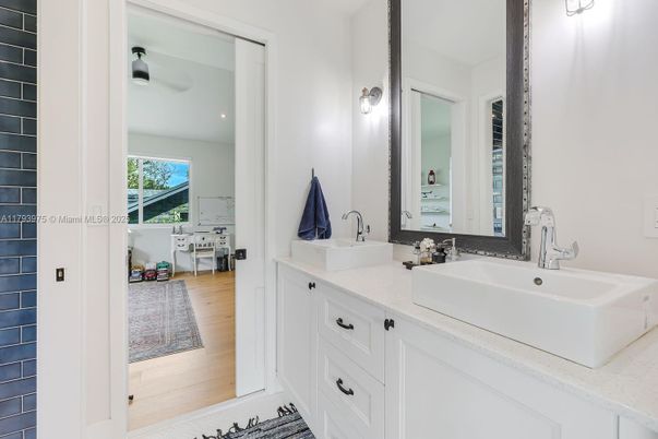 Bathroom, Dual Sink Vanities, Interior, Recessed Lighting, Wood Texture Flooring