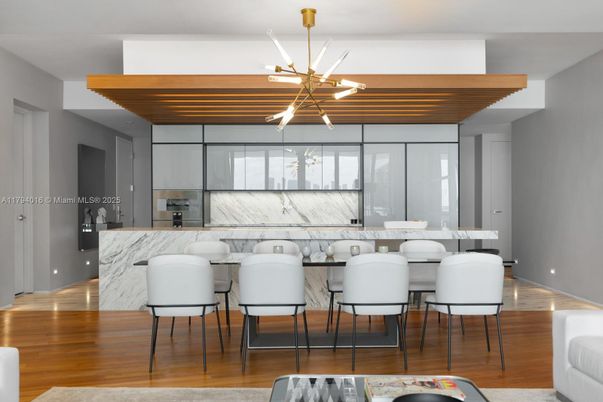 Dining room, Interior, Kitchen, Marble Walls, Pendant Lights, Stainless Steel Appliances, Wood Texture Flooring