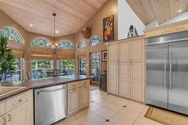 Chandelier, Dining room, Interior, Kitchen, Recessed Lighting, Stainless Steel Appliances, Wooden Ceilings