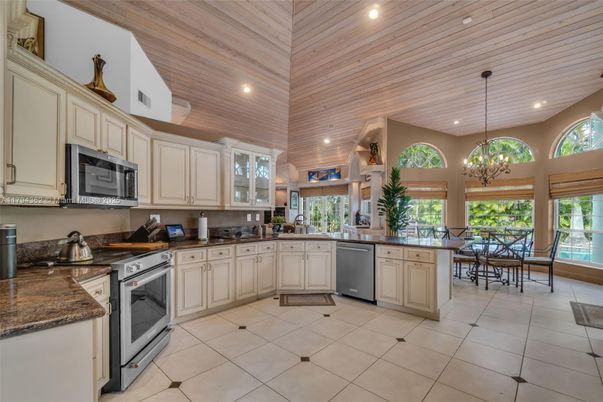 Chandelier, Dining room, Interior, Kitchen, Pendant Lights, Recessed Lighting, Stainless Steel Appliances, Wooden Ceilings