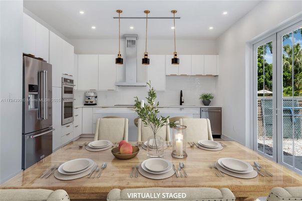 Dining room, Interior, Kitchen, Pendant Lights, Recessed Lighting, Stainless Steel Appliances, Wood Texture Flooring