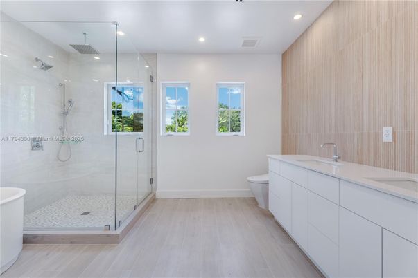 Bathroom, Dual Sink Vanities, Glass Shower, Interior, Recessed Lighting, Wood Texture Flooring