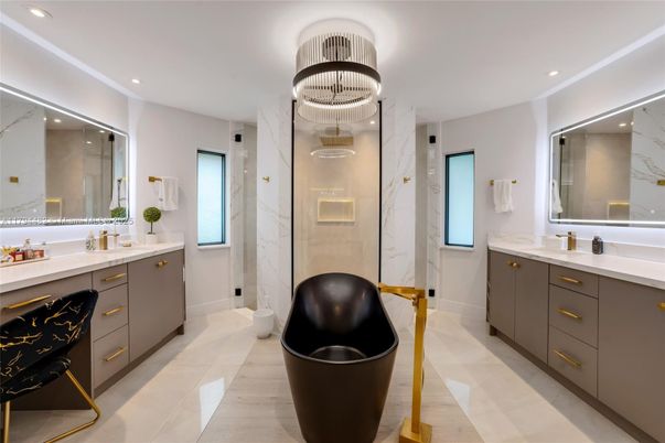 Bathroom, Chandelier, Dual Sink Vanities, Free Standing Baths, Interior, Marble, Marble Walls, Recessed Lighting