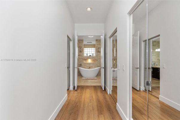 Bathroom, Free Standing Baths, Interior, Recessed Lighting, Stone Walls, Wood Texture Flooring