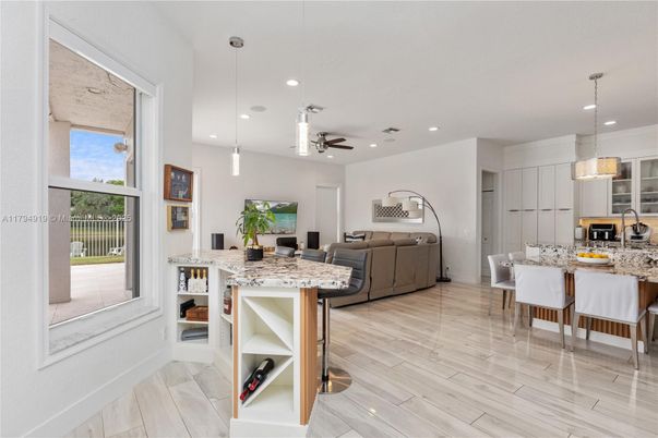 Dining room, Interior, Kitchen, Living room, Pendant Lights, Recessed Lighting, Stainless Steel Appliances, Wood Texture Flooring