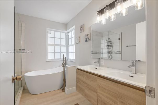 Bathroom, Dual Sink Vanities, Free Standing Baths, Glass Shower, Interior, Wood Texture Flooring