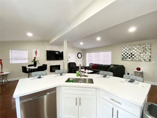Fireplace, Interior, Kitchen, Living room, Recessed Lighting, Stainless Steel Appliances, Stone Walls, Wood Texture Flooring