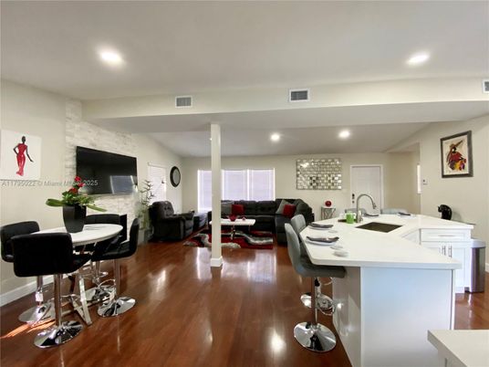 Dining room, Fireplace, Interior, Kitchen, Living room, Recessed Lighting, Stone Walls, Wood Texture Flooring