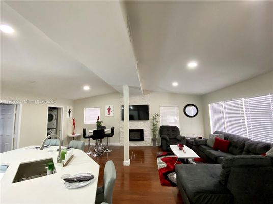 Dining room, Fireplace, Interior, Kitchen, Living room, Recessed Lighting, Stone Walls, Wood Texture Flooring