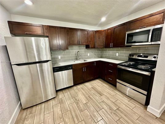 Interior, Kitchen, Recessed Lighting, Stainless Steel Appliances, Wood Texture Flooring
