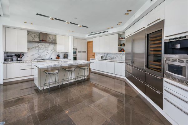 Interior, Kitchen, Marble Walls, Recessed Lighting, Stainless Steel Appliances