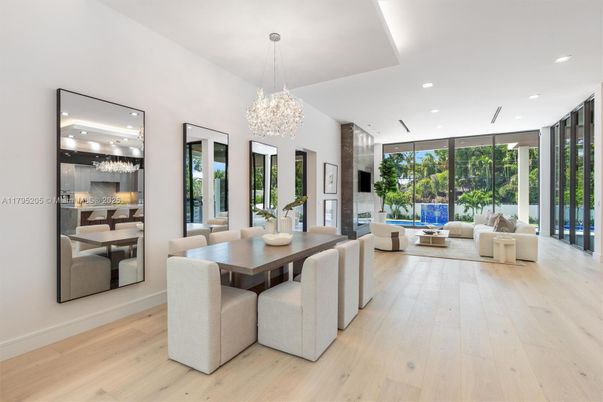 Chandelier, Dining room, Fireplace, Interior, Living room, Pendant Lights, Recessed Lighting, Wood Texture Flooring