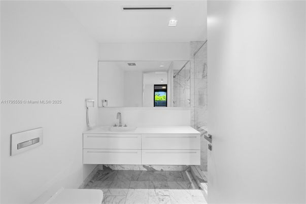 Bathroom, Dual Sink Vanities, Interior, Marble, Marble Walls, Recessed Lighting