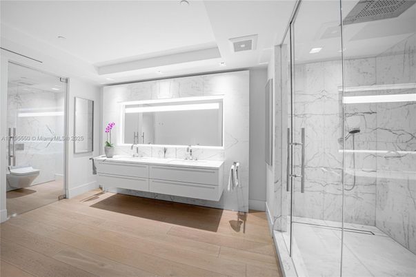 Bathroom, Free Standing Baths, Glass Shower, Interior, Marble, Marble Walls, Recessed Lighting, Wood Texture Flooring