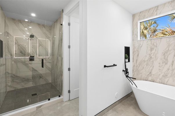 Bathroom, Free Standing Baths, Glass Shower, Interior, Marble Walls, Recessed Lighting