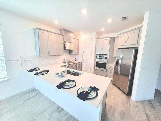 Interior, Kitchen, Recessed Lighting, Stainless Steel Appliances, Wood Texture Flooring