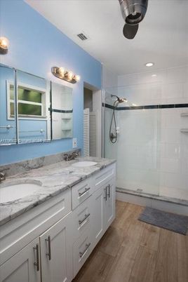 Bathroom, Dual Sink Vanities, Interior, Recessed Lighting, Wood Texture Flooring
