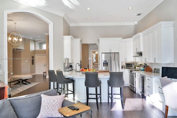 Chandelier, Interior, Kitchen, Pendant Lights, Recessed Lighting, Stainless Steel Appliances, Wood Texture Flooring
