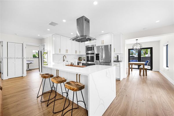 Chandelier, Dining room, Interior, Kitchen, Recessed Lighting, Stainless Steel Appliances, Wood Texture Flooring