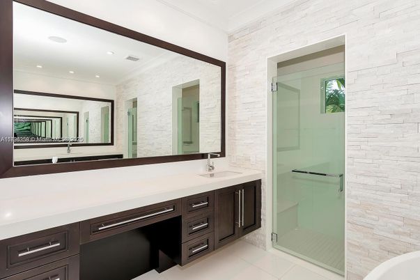 Bathroom, Dual Sink Vanities, Glass Shower, Interior, Recessed Lighting, Stone Walls