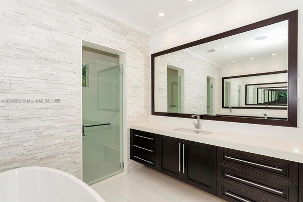 Bathroom, Dual Sink Vanities, Free Standing Baths, Glass Shower, Interior, Recessed Lighting, Stone Walls