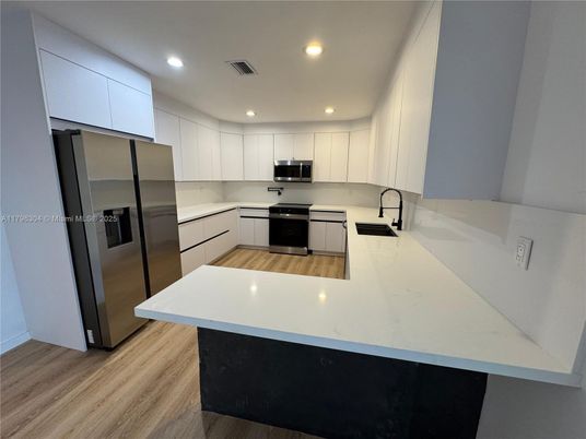 Interior, Kitchen, Recessed Lighting, Stainless Steel Appliances, Wood Texture Flooring