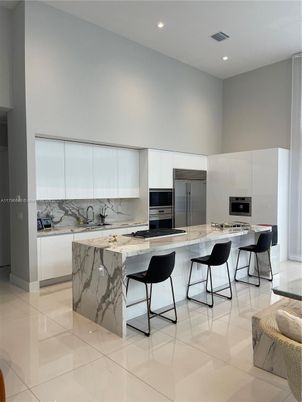 Interior, Kitchen, Marble Walls, Recessed Lighting, Stainless Steel Appliances